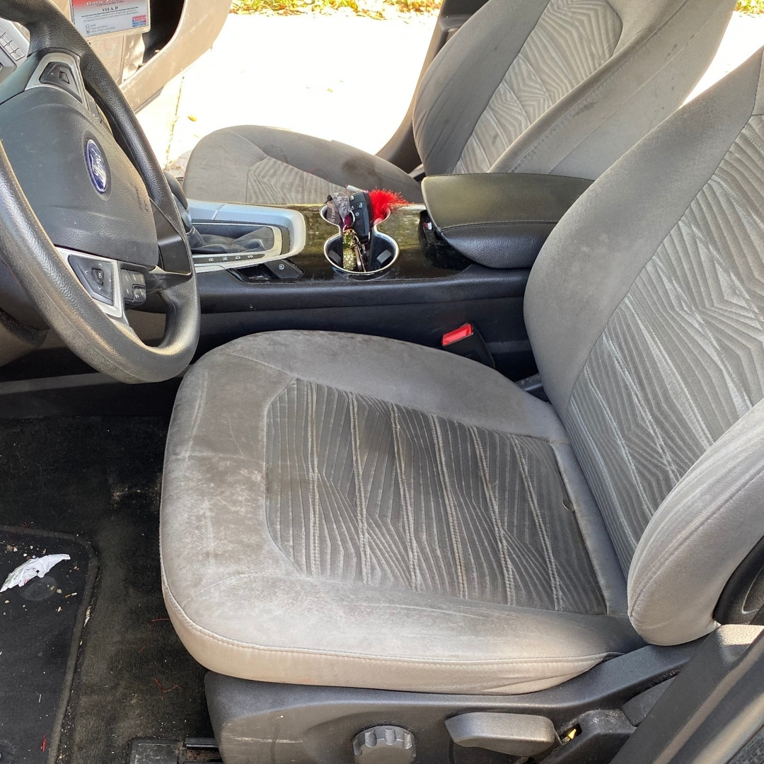 Before: the same car interior before detailing